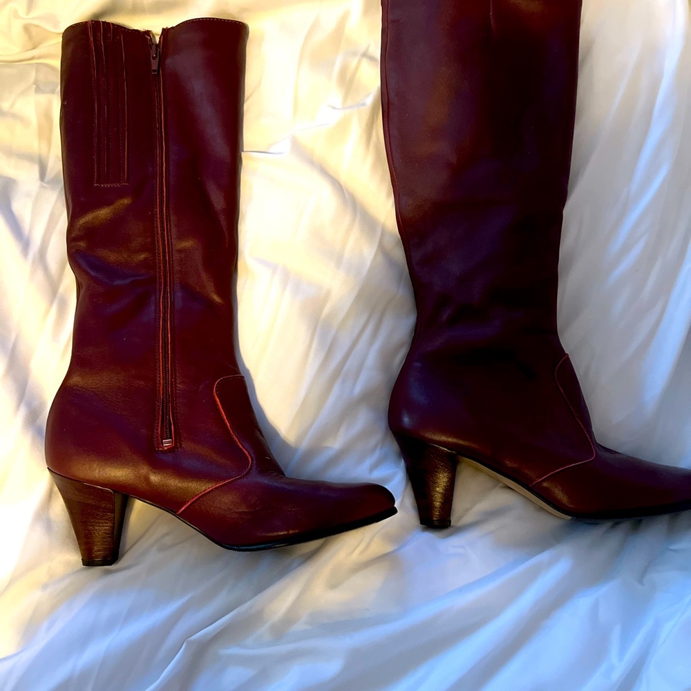 Vintage red/burgundy knee high all leather boots.